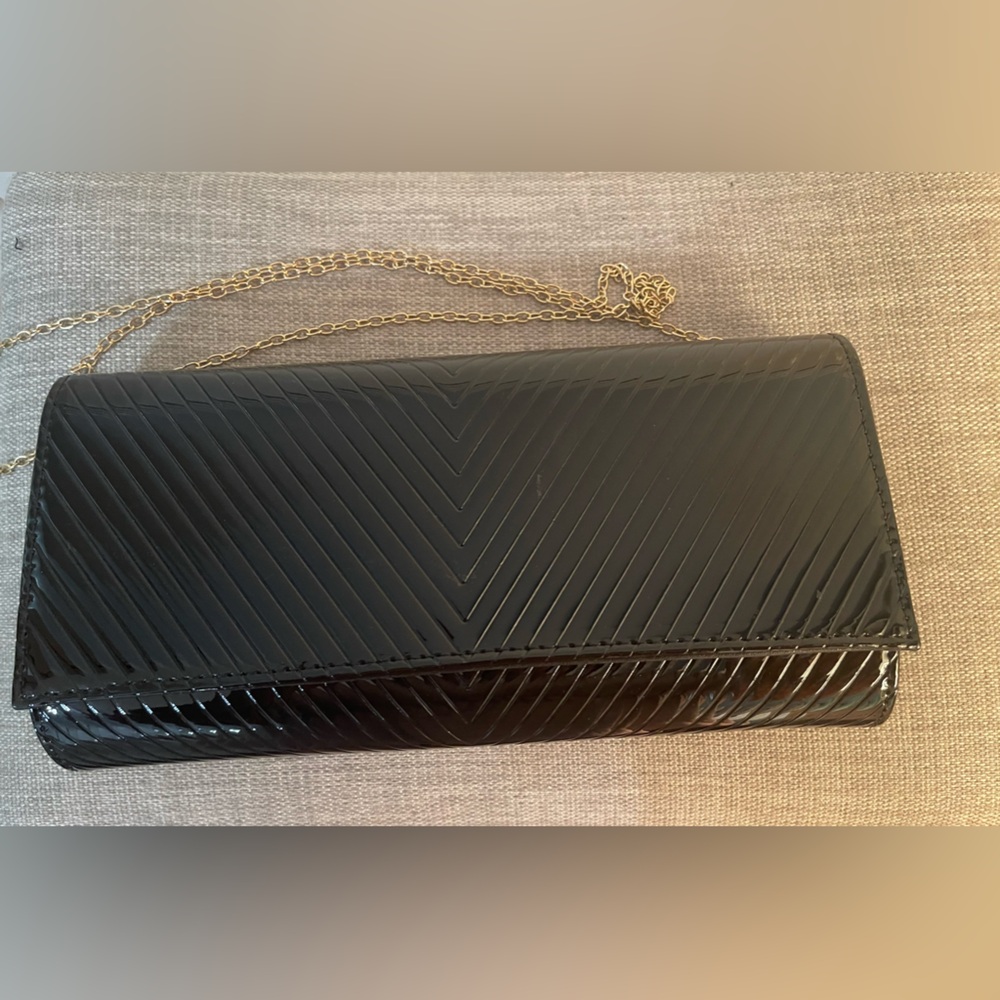 Black shiney clutch with gold chain strap
